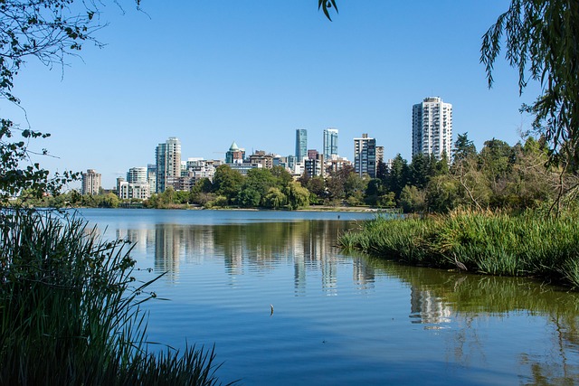 Vancouver City Skyline With Stanley Park And SkyTrain In View