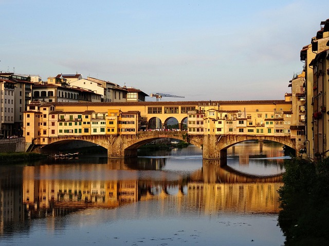 Ponte Vecchio Florence Sunset View With Pedestrians And Jewelry Shops