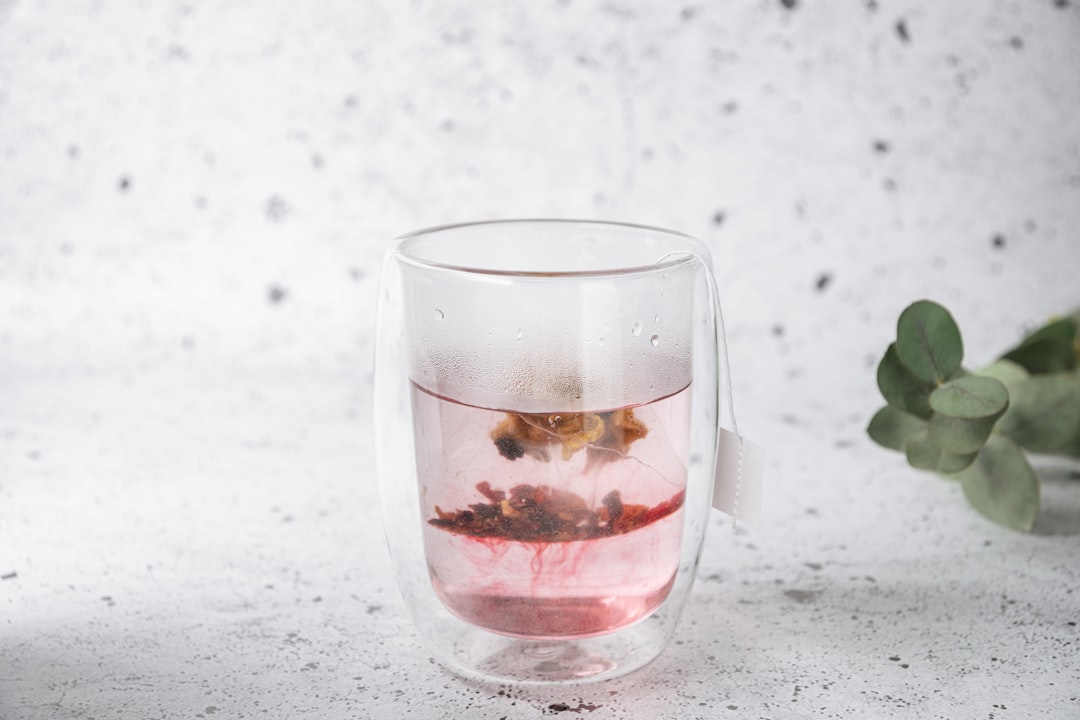 Hibiscus Tea In A Glass With Ice And A Slice Of Lemon