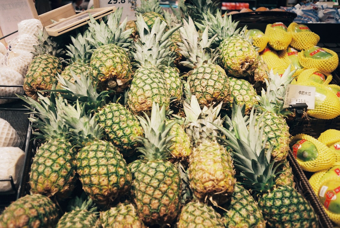 Pineapple With Soft Or Leaking Base In A Grocery Store Setting