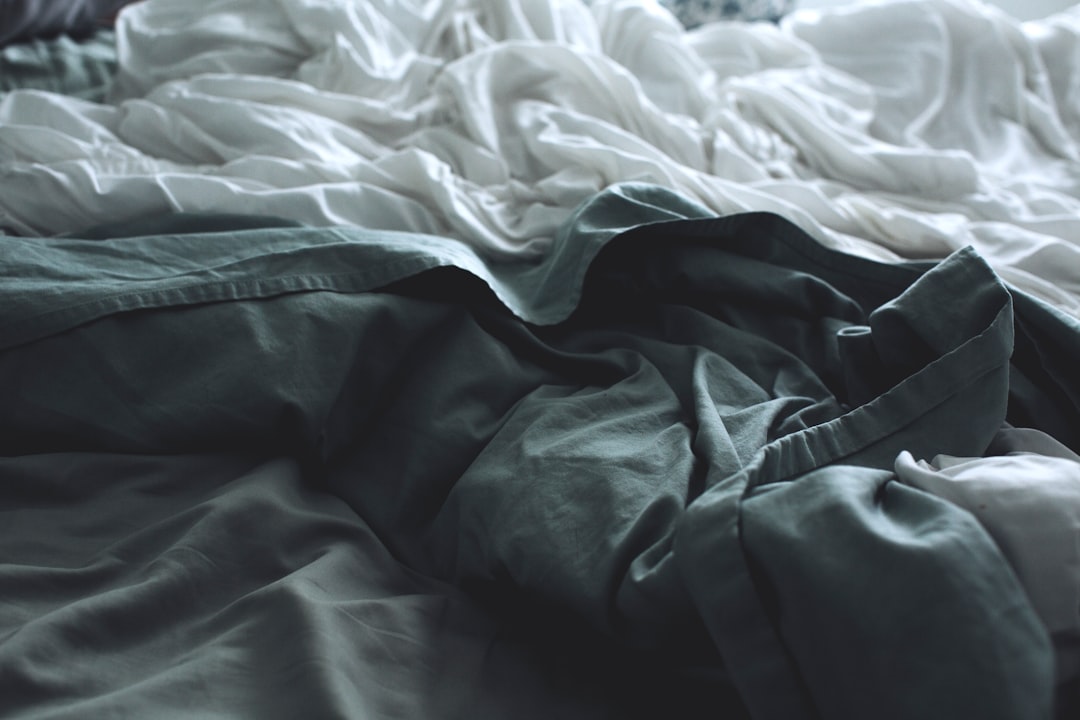 Wrinkled Clothing On A Hanger Or Laid Out On A Bed