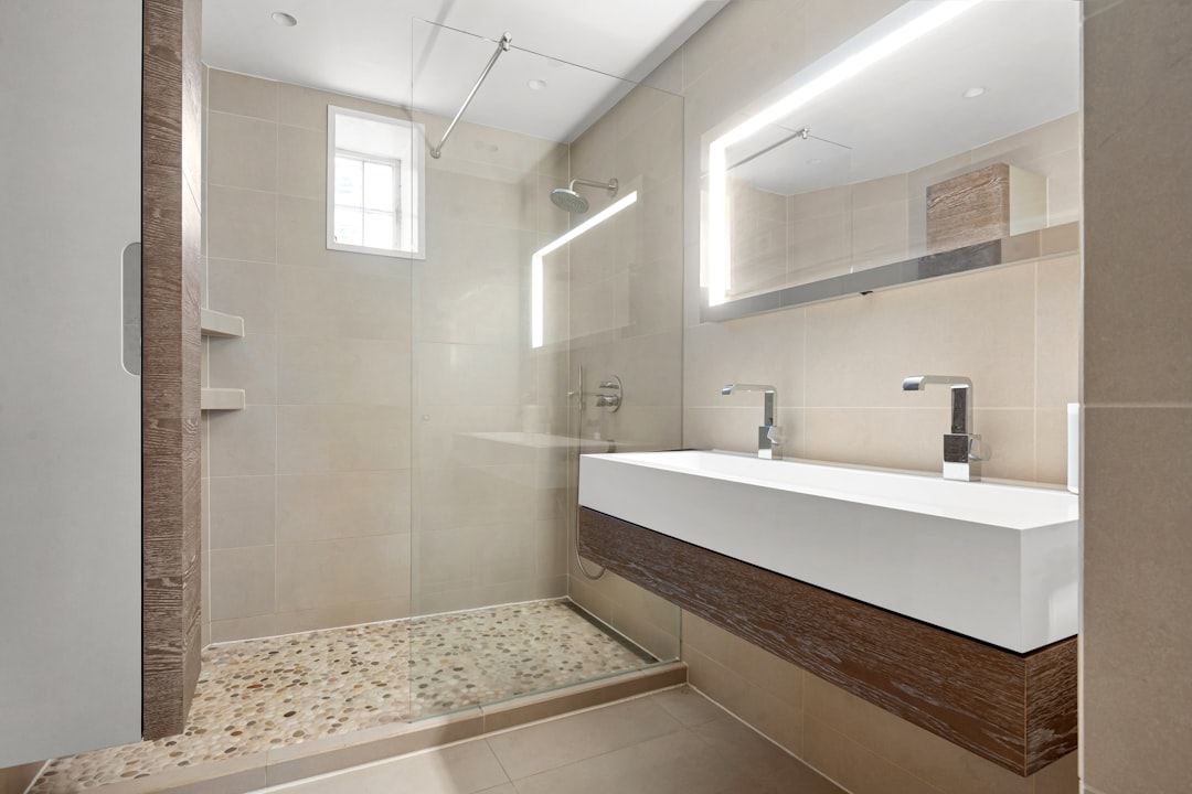 Spa Like Bathroom With Rainfall Showerhead, Deep Soaking Tub, High-quality Tiles, And Modern Fixtures
