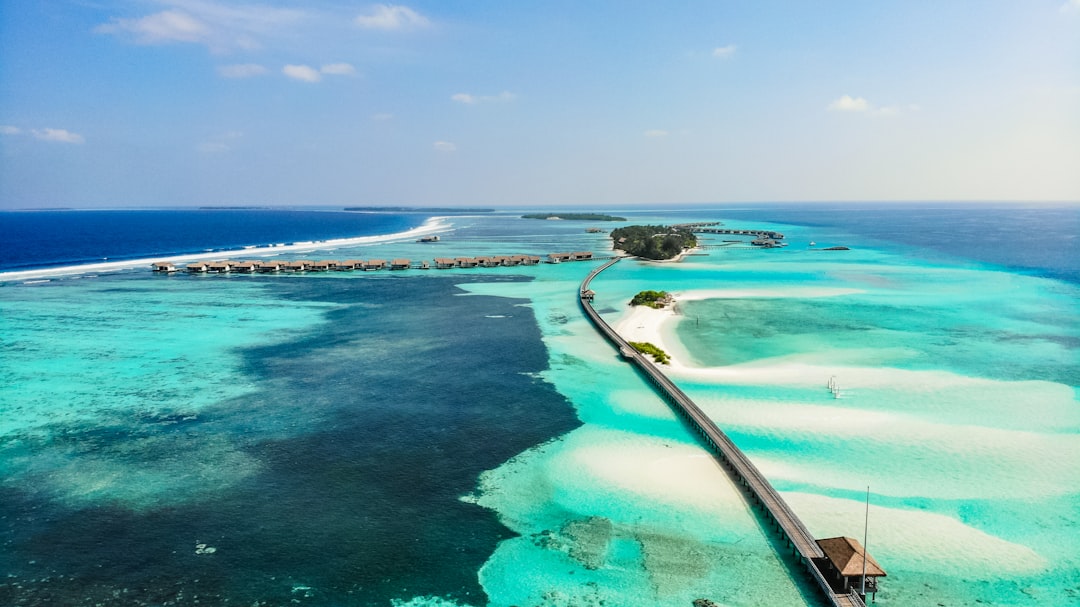 Maldives Islands With Luxury Resorts And Clear Blue Waters