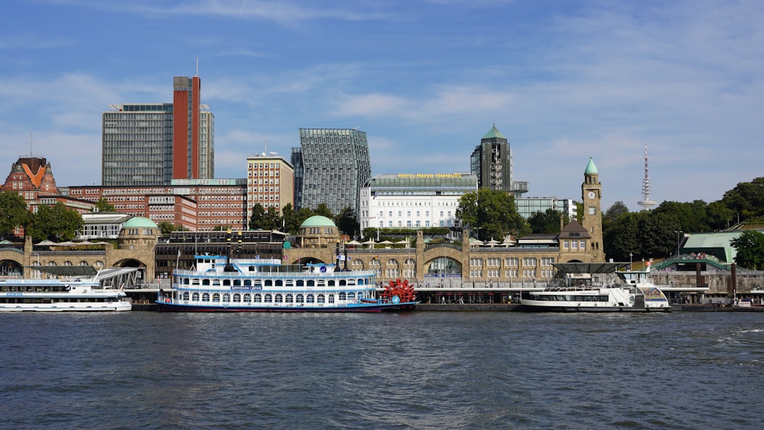 Hamburg Cityscape With Modern Architecture, Public Transport Ferries, Parks, And Lakes