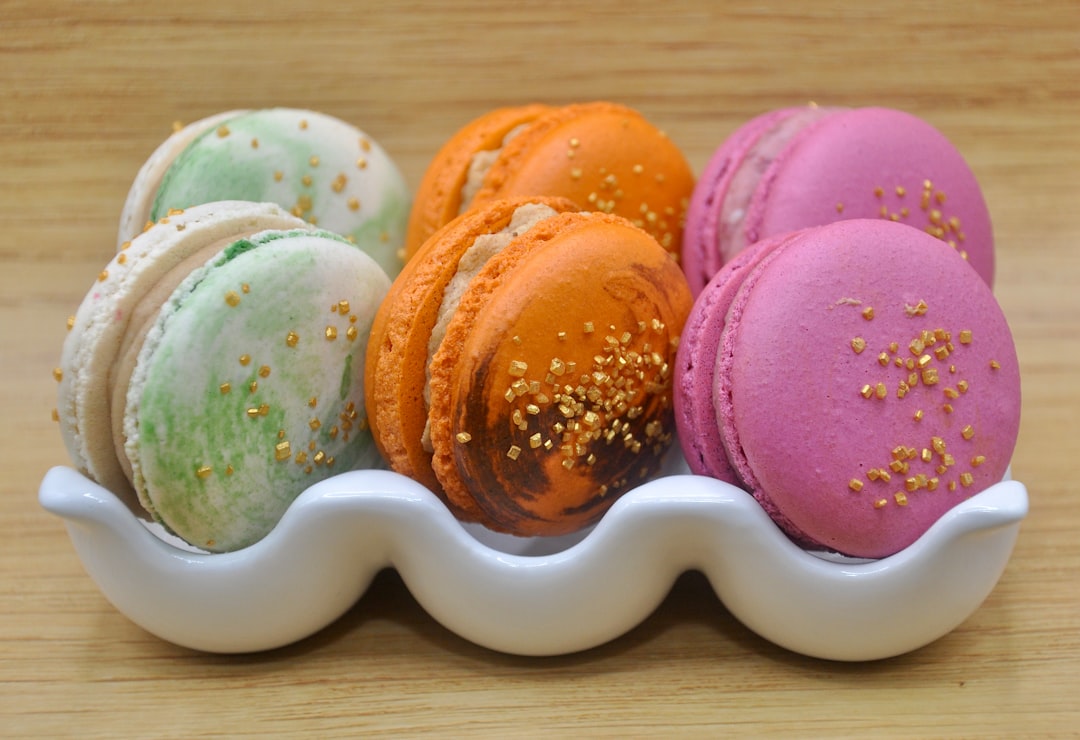 Macarons In Elegant Boxes With Vibrant Colors And Smooth Domed Shells