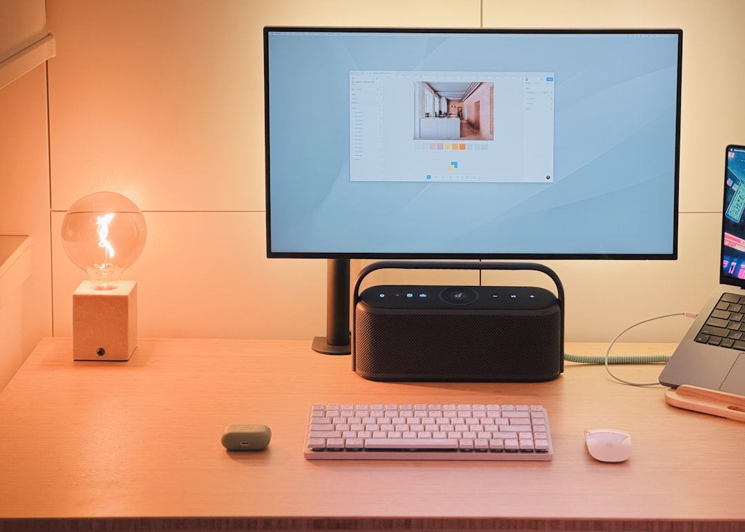 Desktop Air Purifier On A Modern Office Desk With A Laptop, Plants, And Stationery