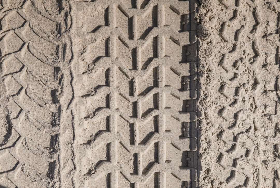 Worn Tire Tread With Visible Tread Wear Indicators And Shallow Grooves