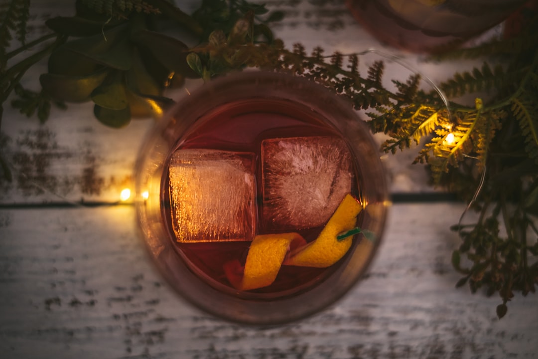Negroni Cocktail With Dark, Rich Colors And Garnished With An Orange Twist, Set Against A Moody, Dramatic Background