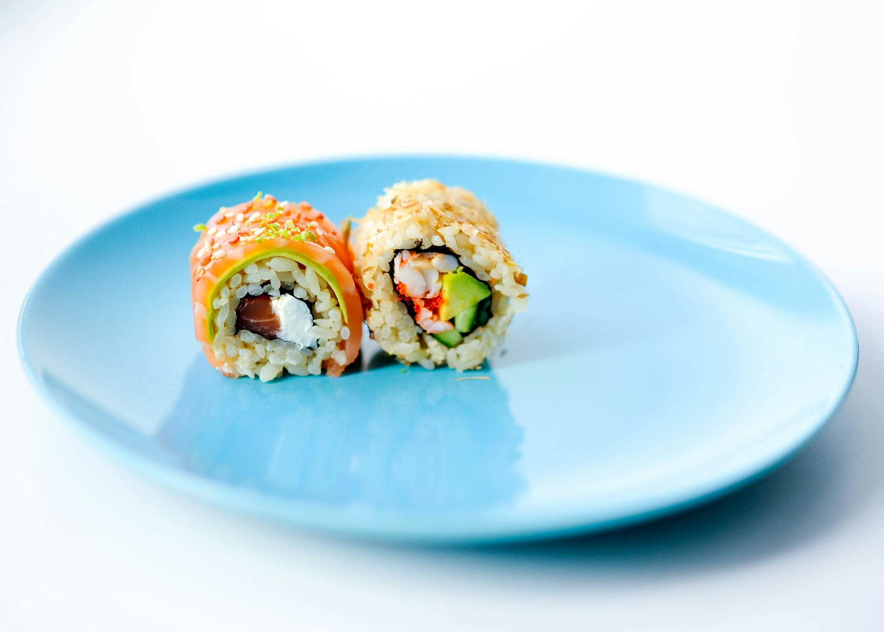 California Roll Sushi With Imitation Crab, Avocado, Cucumber, And Sesame Seeds, Inside Out With Rice On The Outside