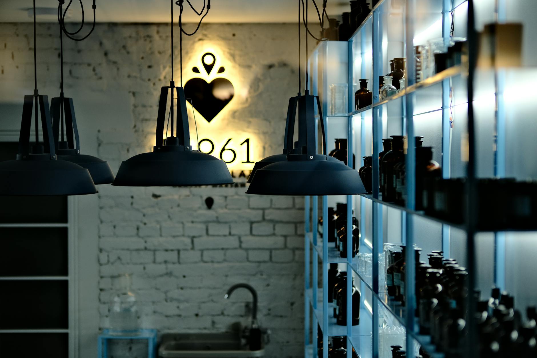 Open Metal Shelving Units In An Industrial Loft Setting With Books, Ceramics, And Baskets Arranged On Powder Coated Steel Shelves