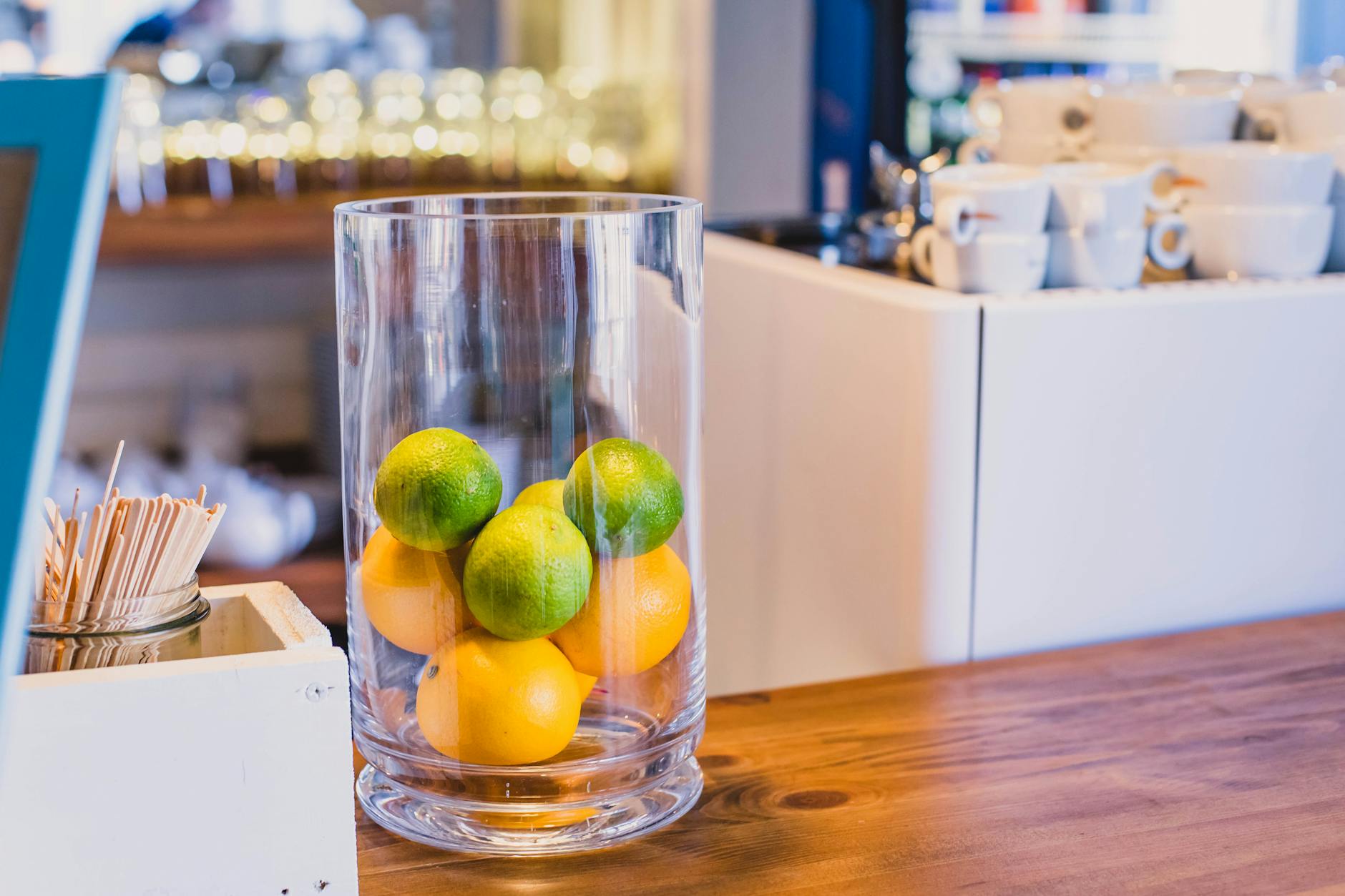 Fresh Citrus Fruit Displays In Bowls With Lemons And Limes On A Wedding Table With White Linens And Hydrangeas