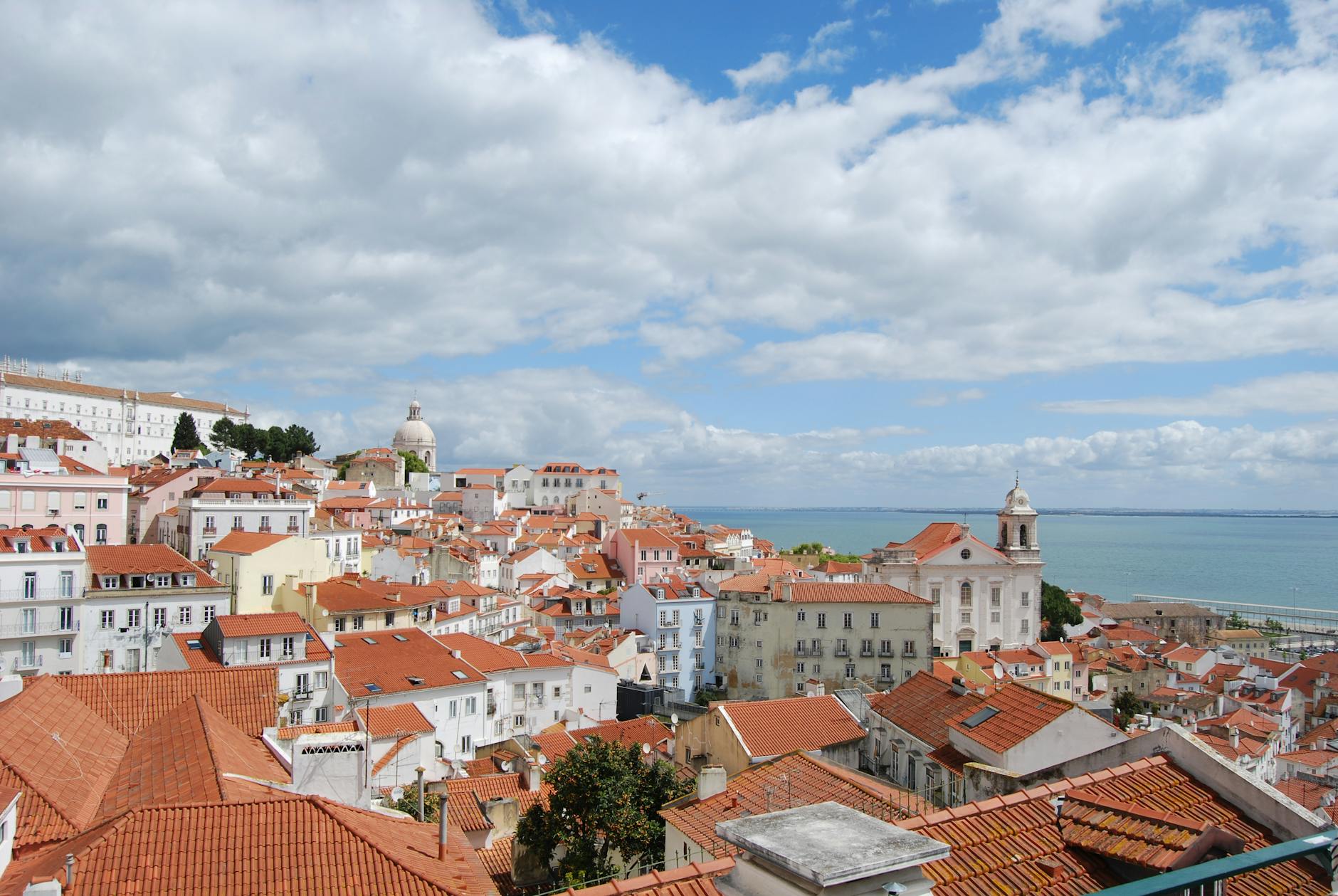 Lisbon Cityscape With Hills, Miradouros, Trams, And Local Tascas