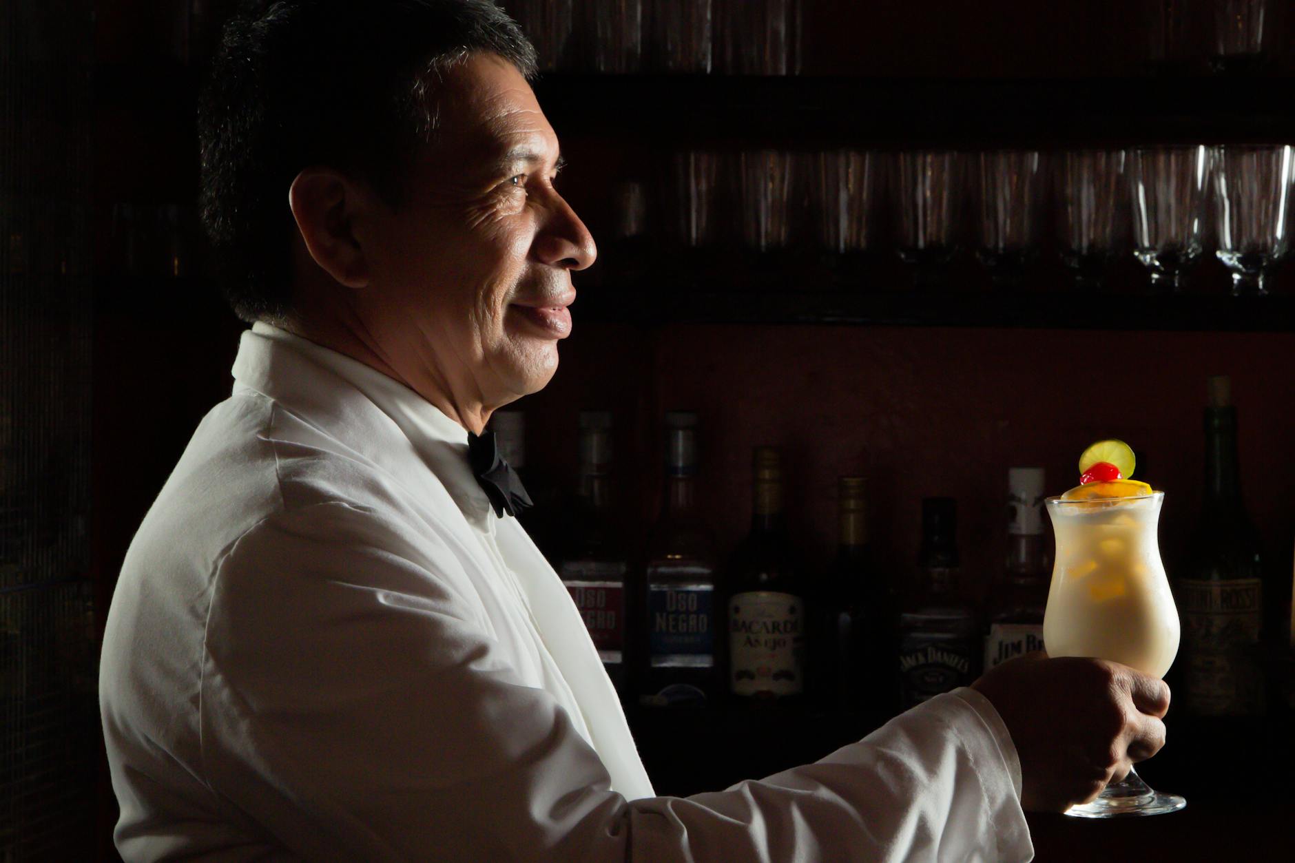 Piña Colada Cocktail In A Cozy Setting With Soft Lighting And Tropical Decorations