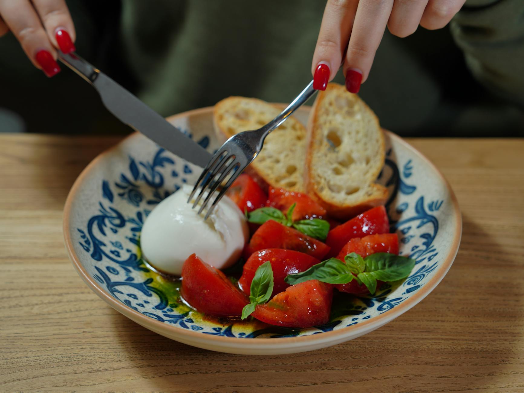 Caprese Salad Board With Tomatoes, Mozzarella, Basil, Balsamic Glaze, Olive Oil, Italian Bread, Sea Salt, And Black Pepper