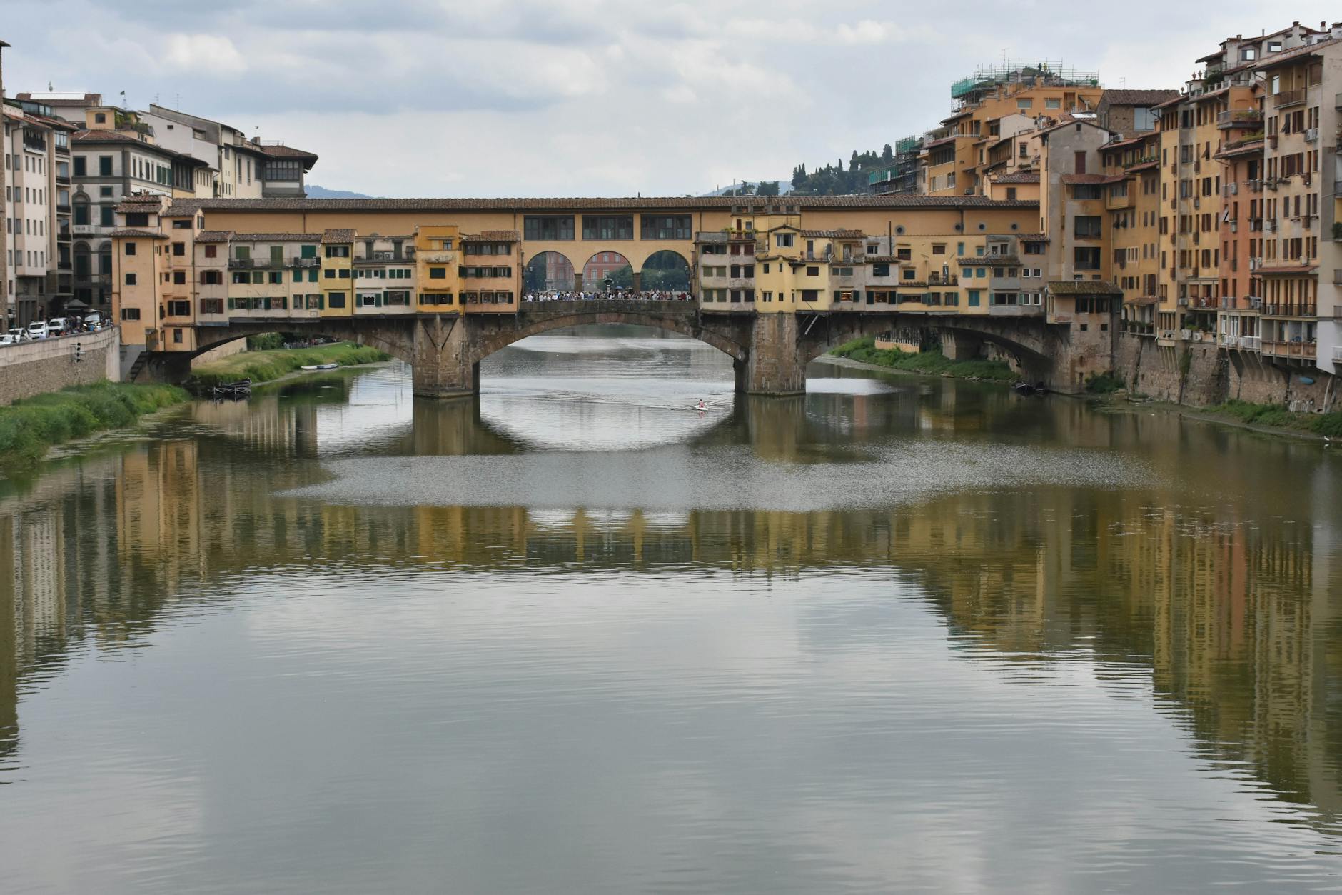 Ponte Vecchio Bridge Over The Arno River In Florence With Jewelry Shops And Art Dealers