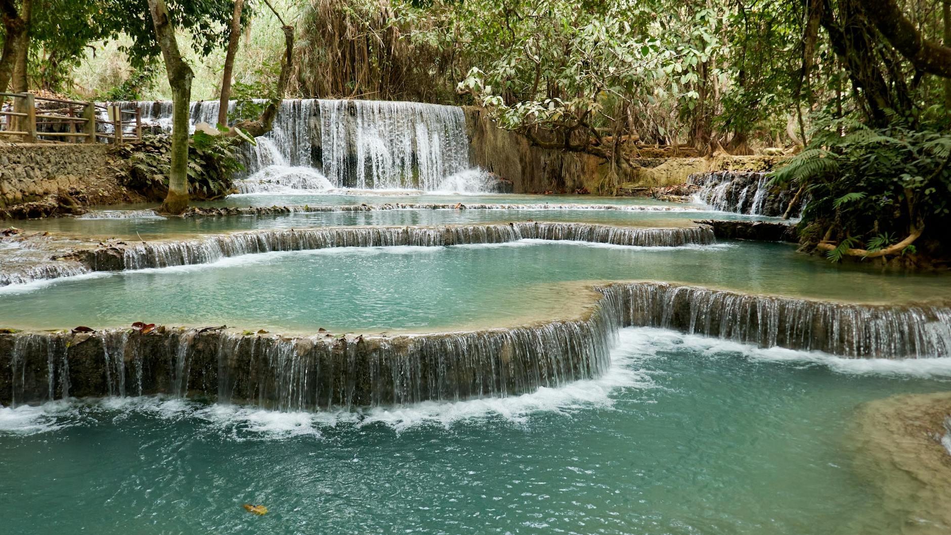 Kuang Si Falls Tiered Cascade With Milky Blue Pools And Forest Trails