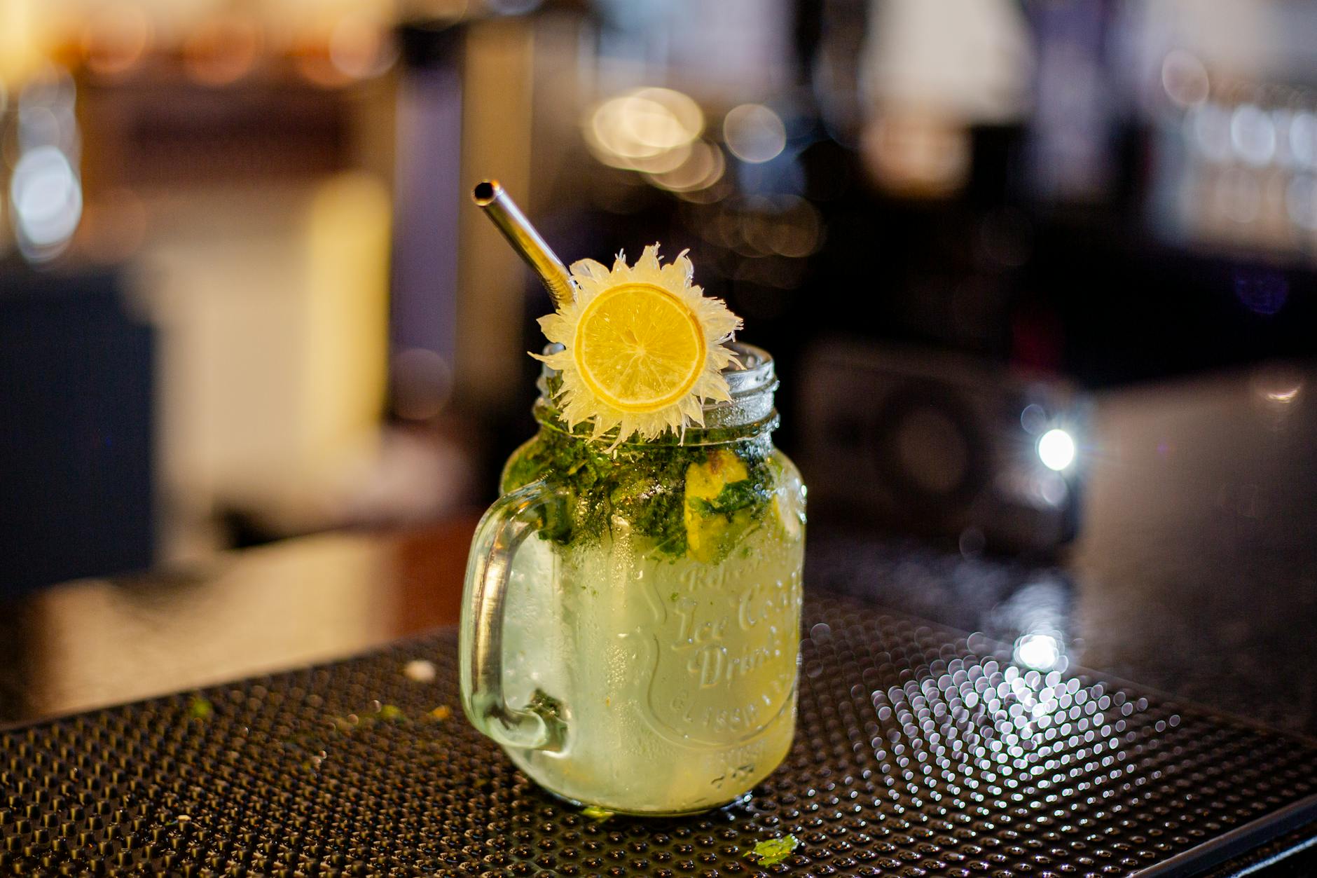 Mojito Cocktail With Mint, Lime, And Bubbles In A Lively Setting