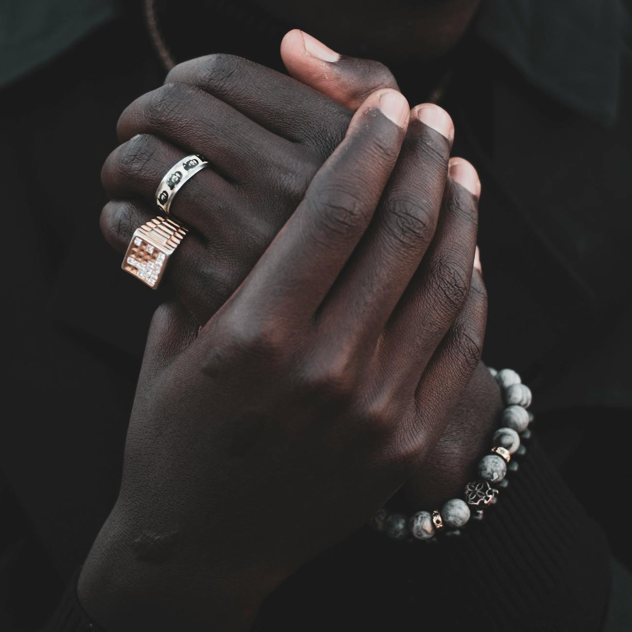 Heavy Jewelry On A Male Model, Showcasing Thick Chains, Large Rings, And Bracelets In A Stylish Outfit