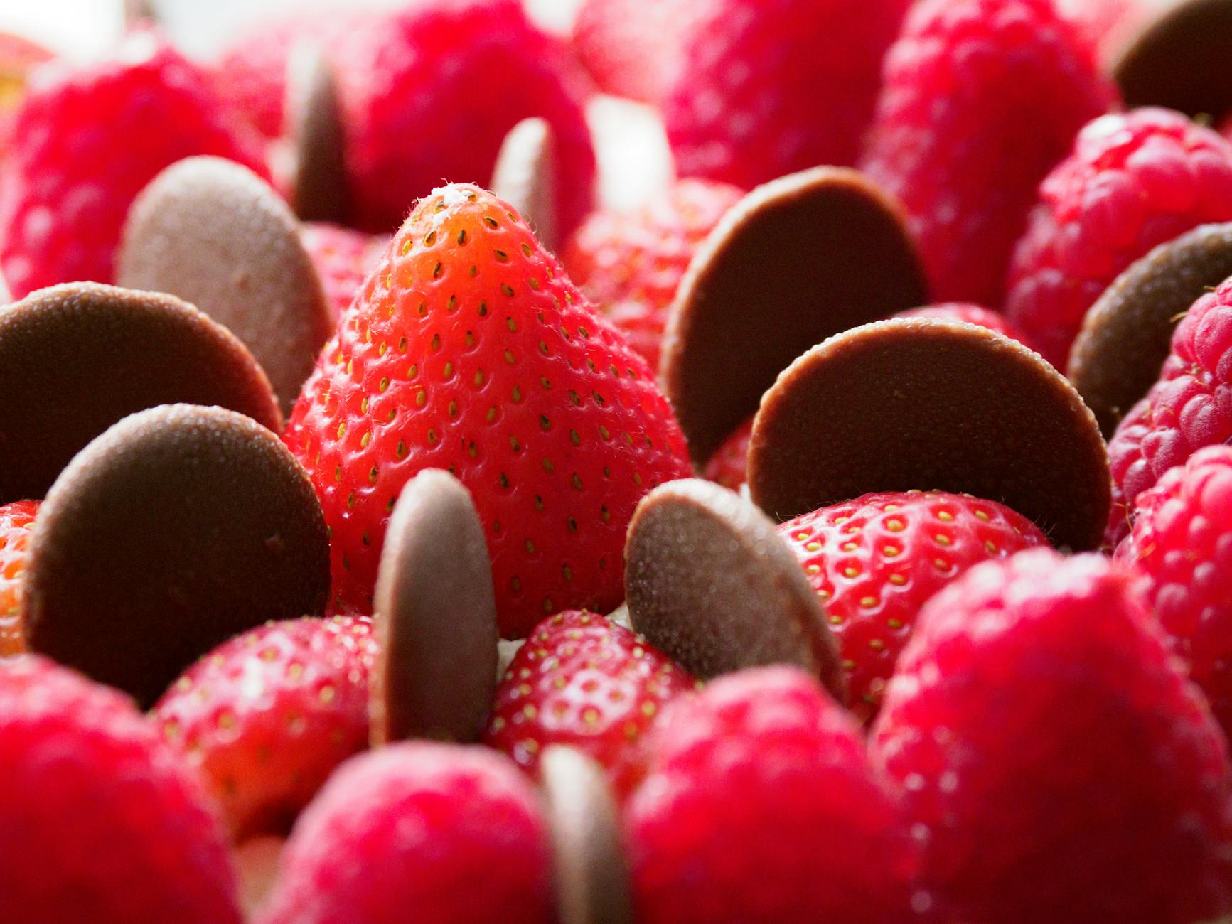 Chocolate Shards With Fresh Raspberries And Strawberries On A Rustic Platter