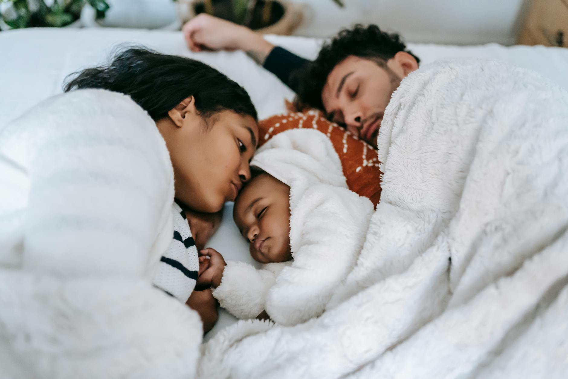 Families Co-sleeping In A Bedroom