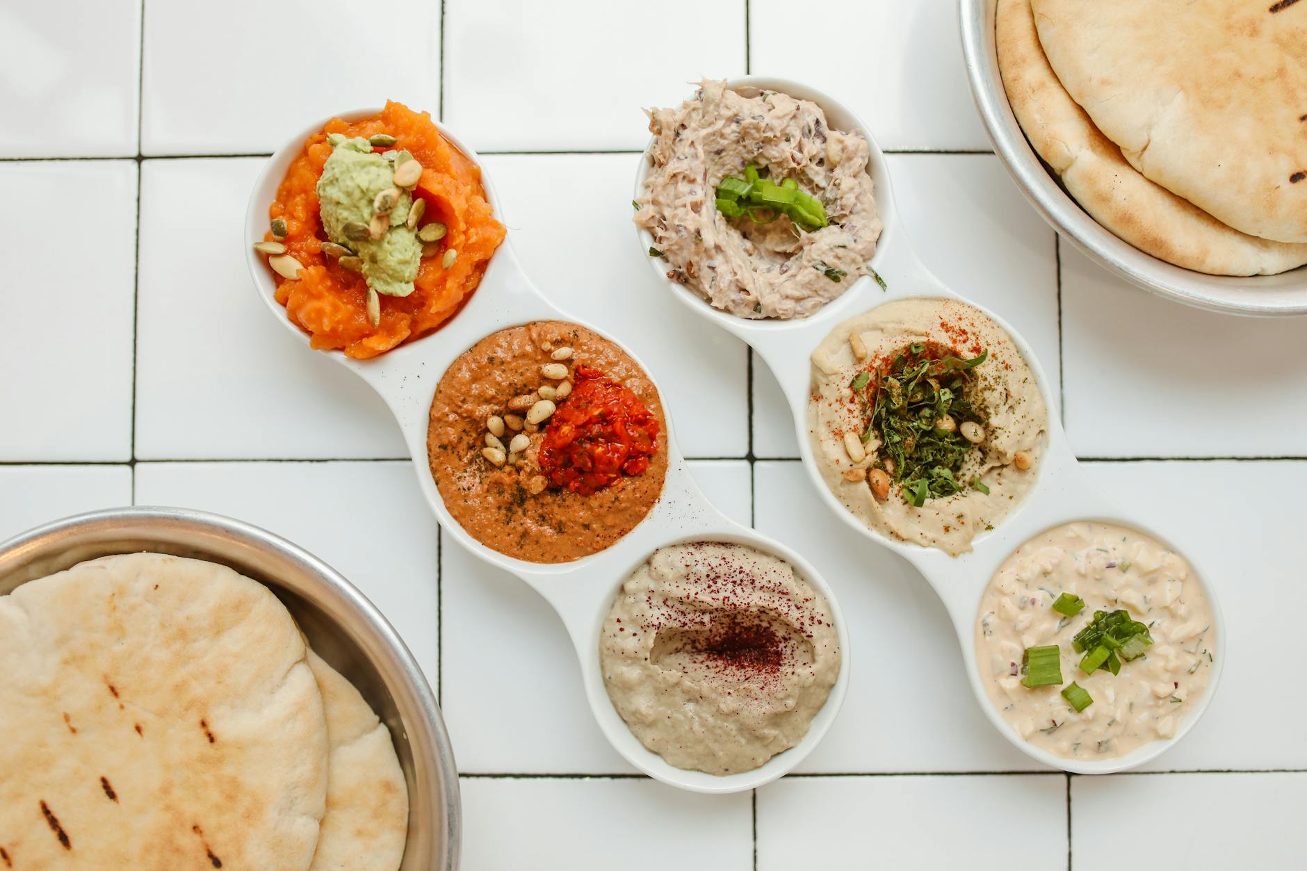 Mediterranean Mezze Platter With Hummus, Tzatziki, Pita Bread, Marinated Olives, Artichoke Hearts, Feta Cheese, Cucumber