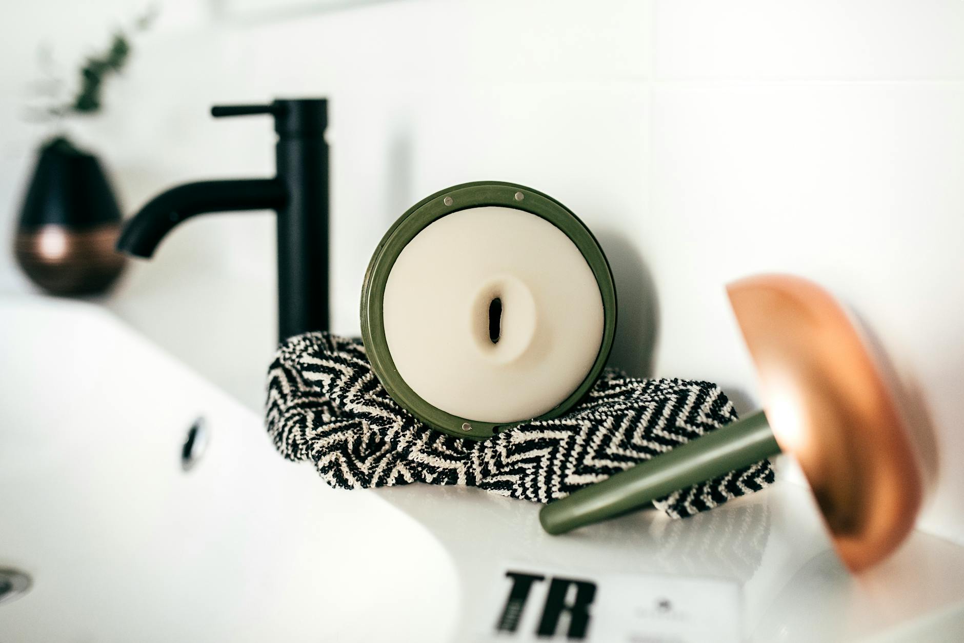 Black Faucet And Hardware Set In A Modern Kitchen Or Bathroom Setting