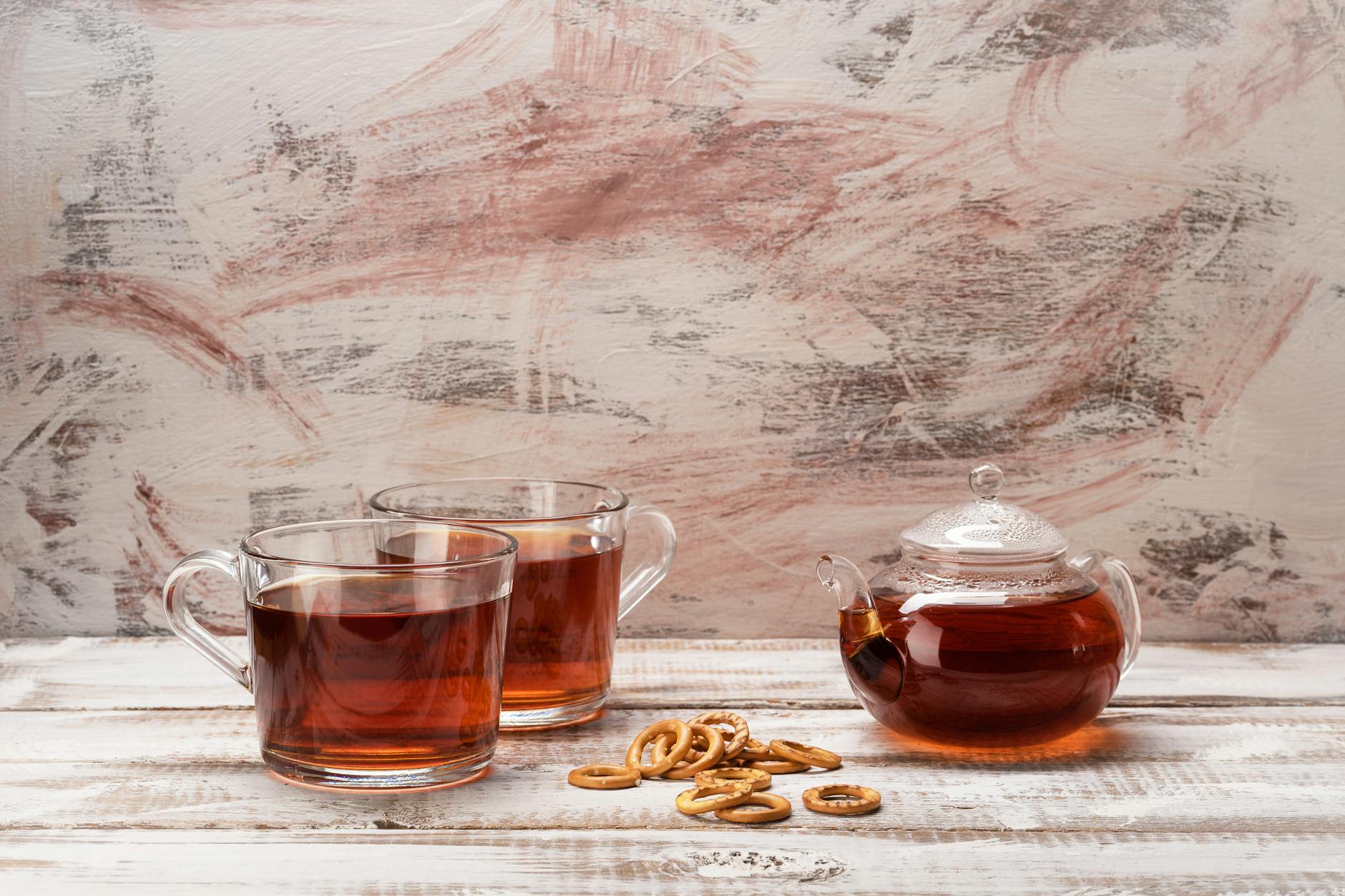 Slippery Elm Tea In A Cup With Loose Bark And A Teapot On A Wooden Table