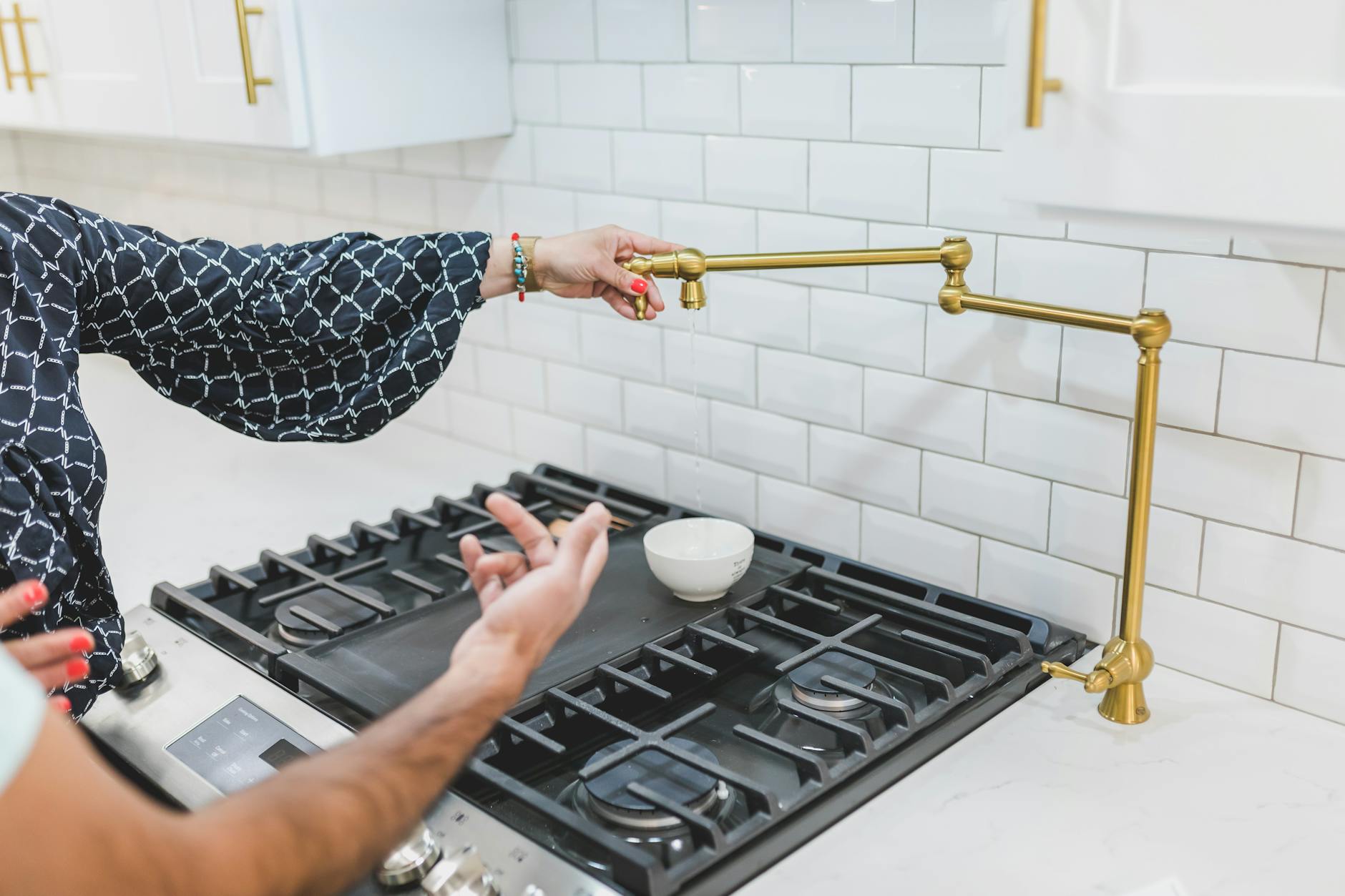 Pot Filler Faucet Installed Above A Stove In A Luxury Kitchen