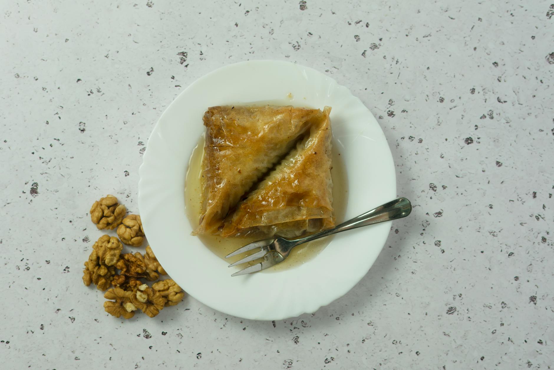 Baklava Dessert With Layers Of Phyllo Dough, Nuts, And Honey Syrup