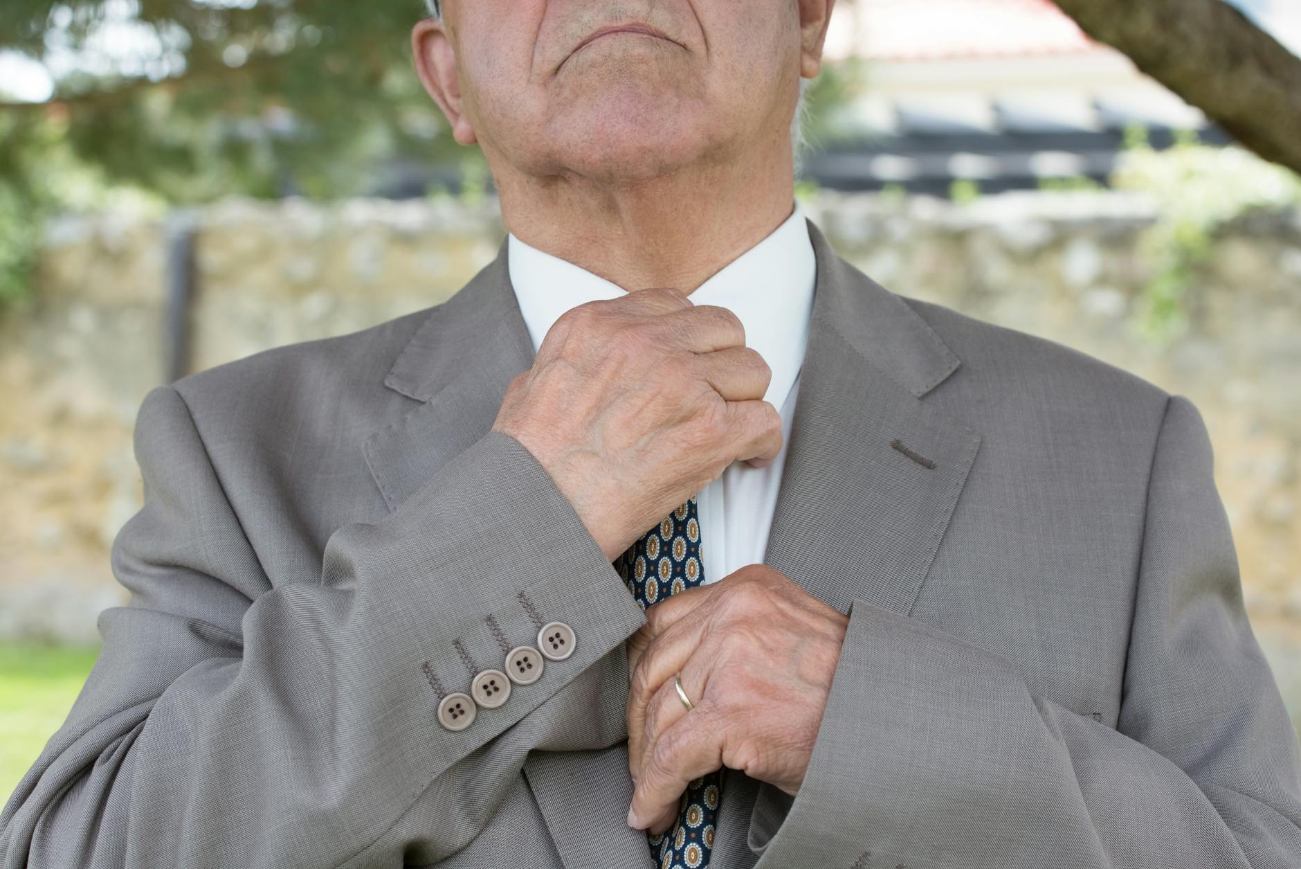 Man Wearing A Suit With Properly Adjusted Tie Length