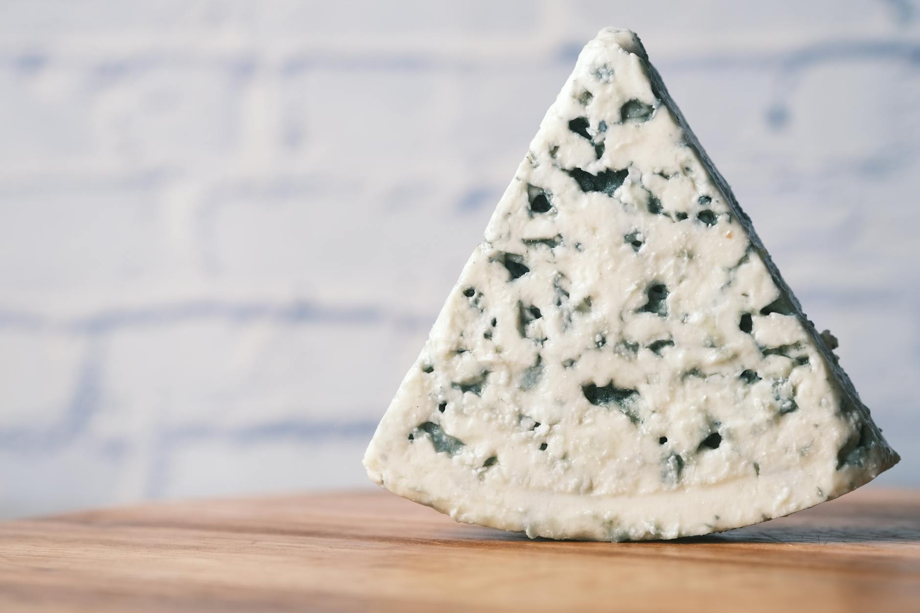 Stilton Cheese With Blue Veins And Marbled Appearance