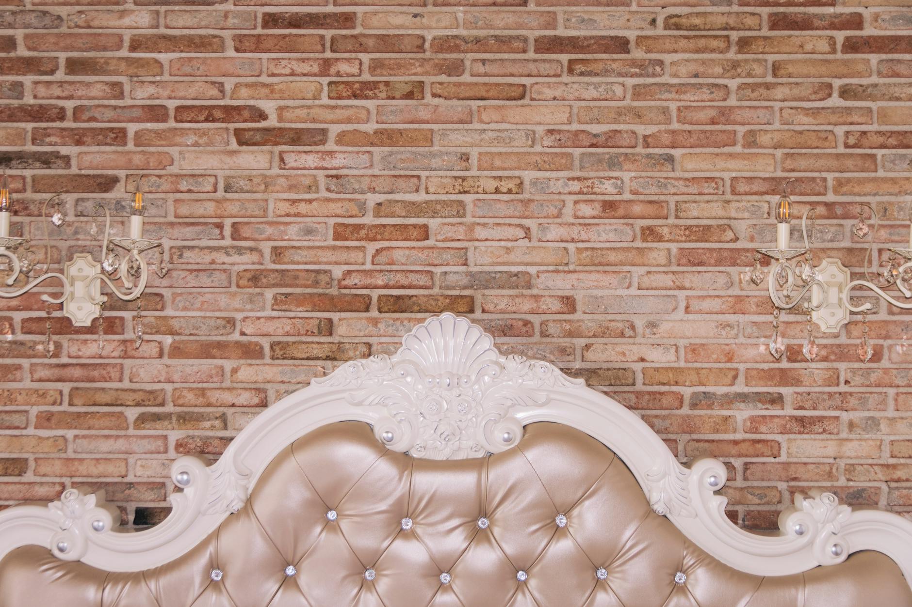 Upholstered Tufted Headboard With Diamond Shapes And Covered Buttons In A Cozy Bedroom Setting