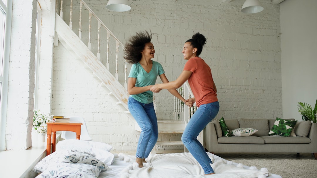Lesbian Couple Dancing In Living Room