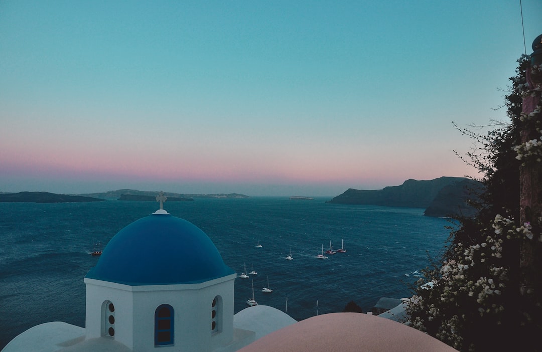 Santorini Honeymoon Sunset Views Whitewashed Buildings Blue-domed Churches Luxury Suites Volcanic Landscape