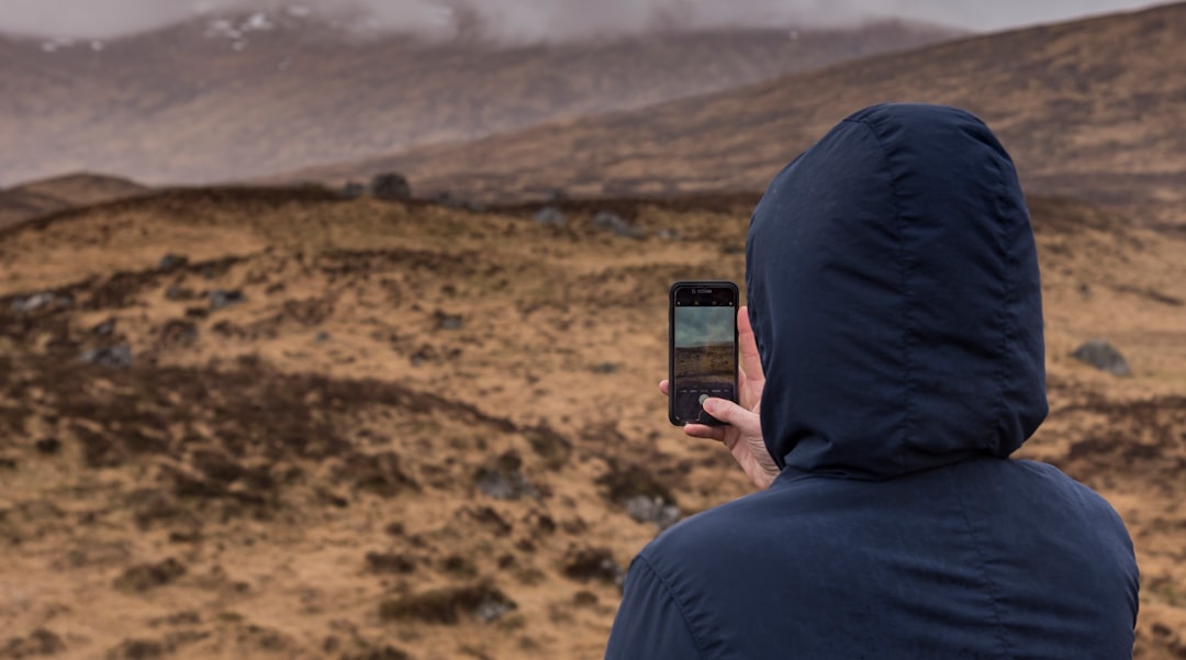Man Changing Phone Background To Landscape