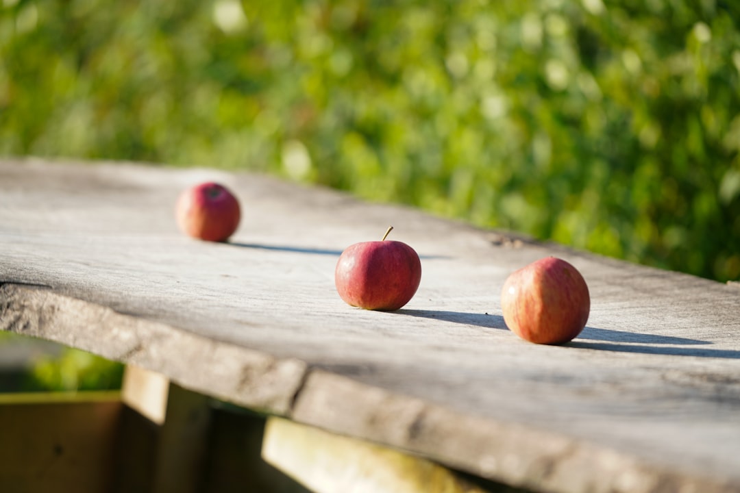 Fresh Apples On Wooden Table