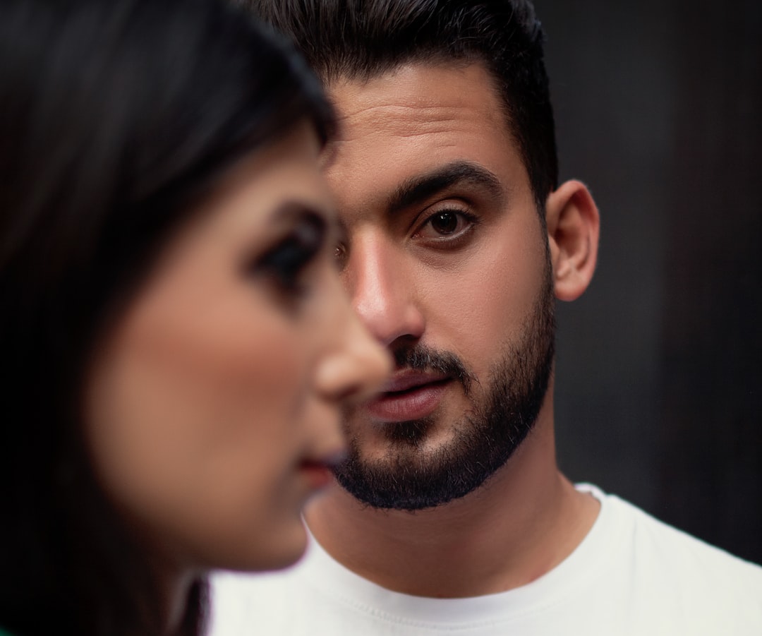 Person Avoiding Eye Contact During Conversation