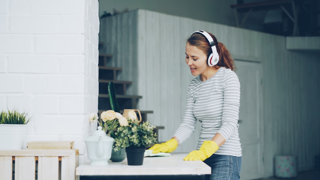 Person Listening To Podcasts While Doing Chores