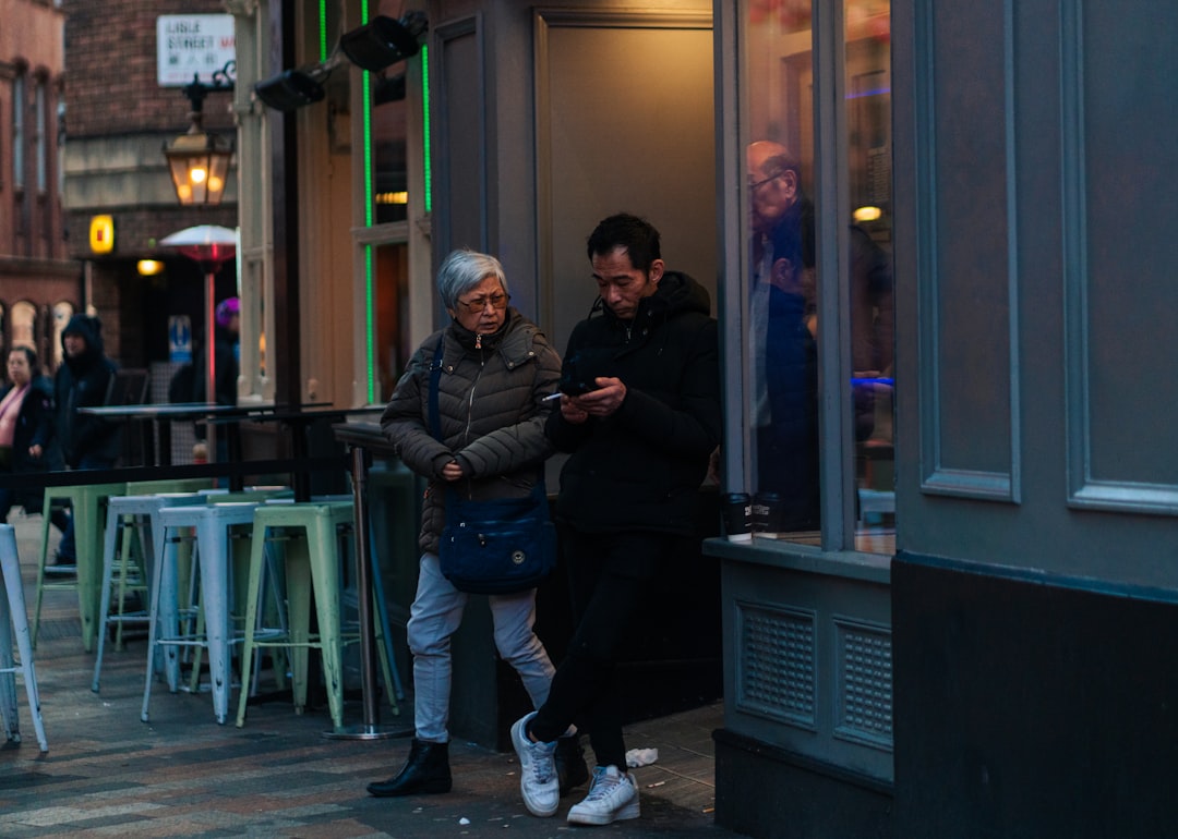 Person Ignoring Conversation Using Smartphone