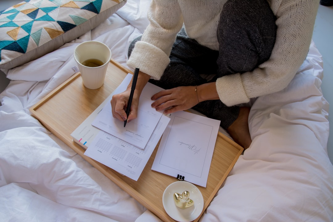 Person Writing To-do List In Morning