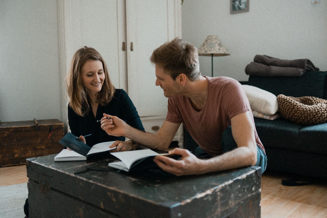 Couple Discussing Finances With Credit Score Report