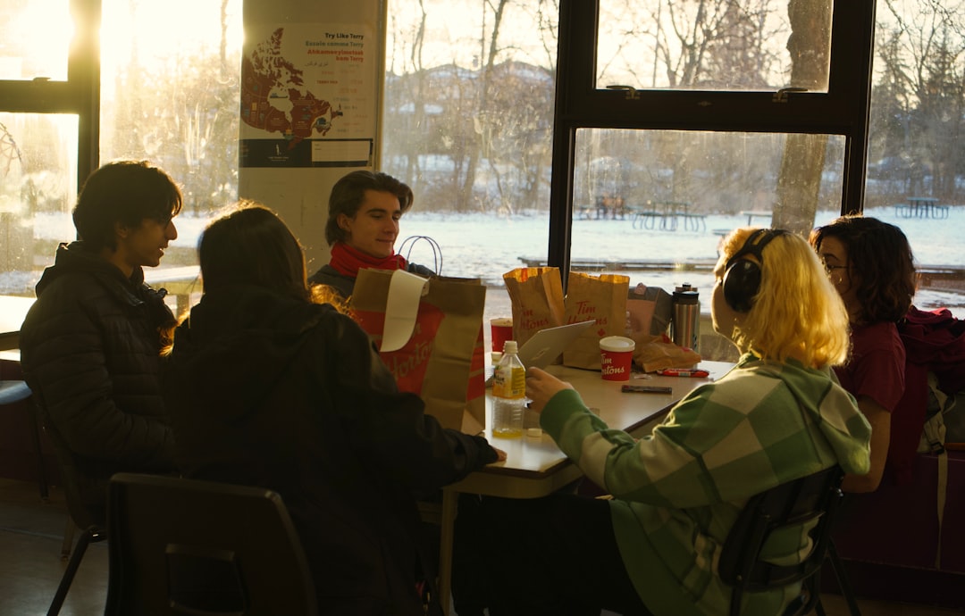 Group Of Diners Reading Menu