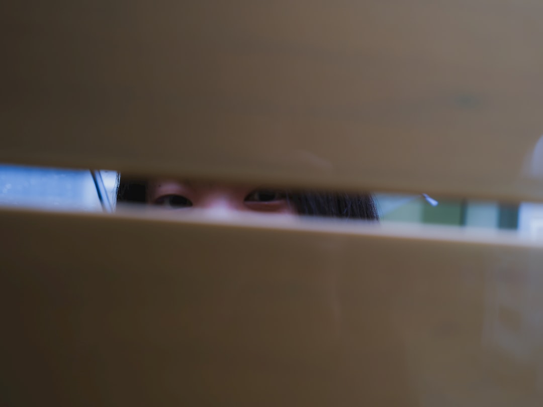 Person Hiding Behind A Door