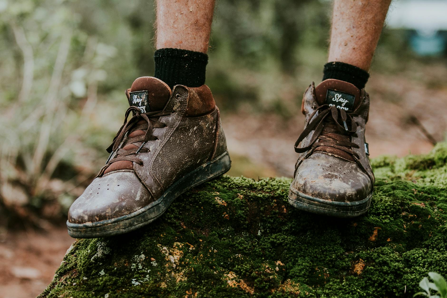 Person Scraping Mud of Shoes