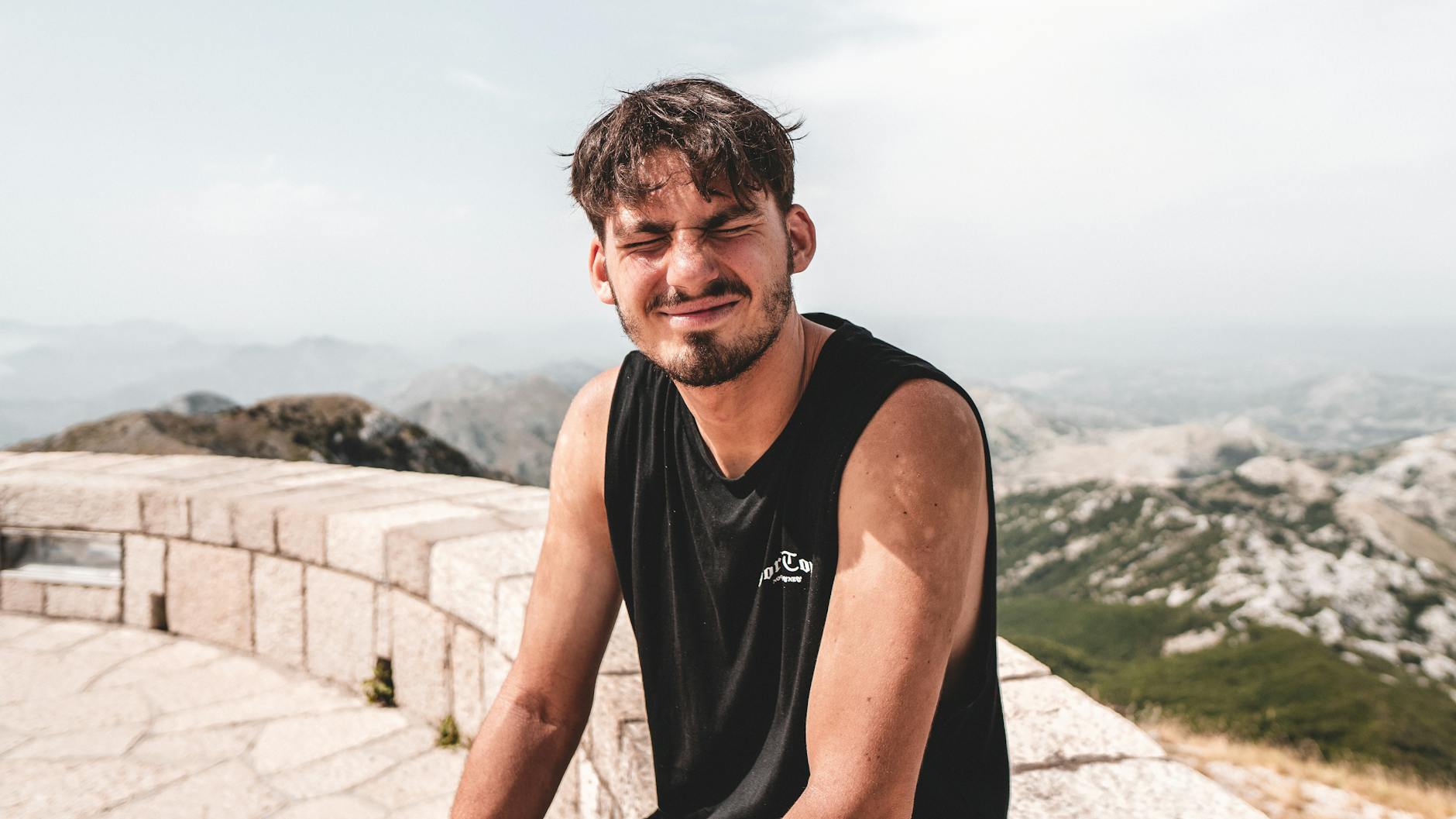 Person Squinting In Sunlight