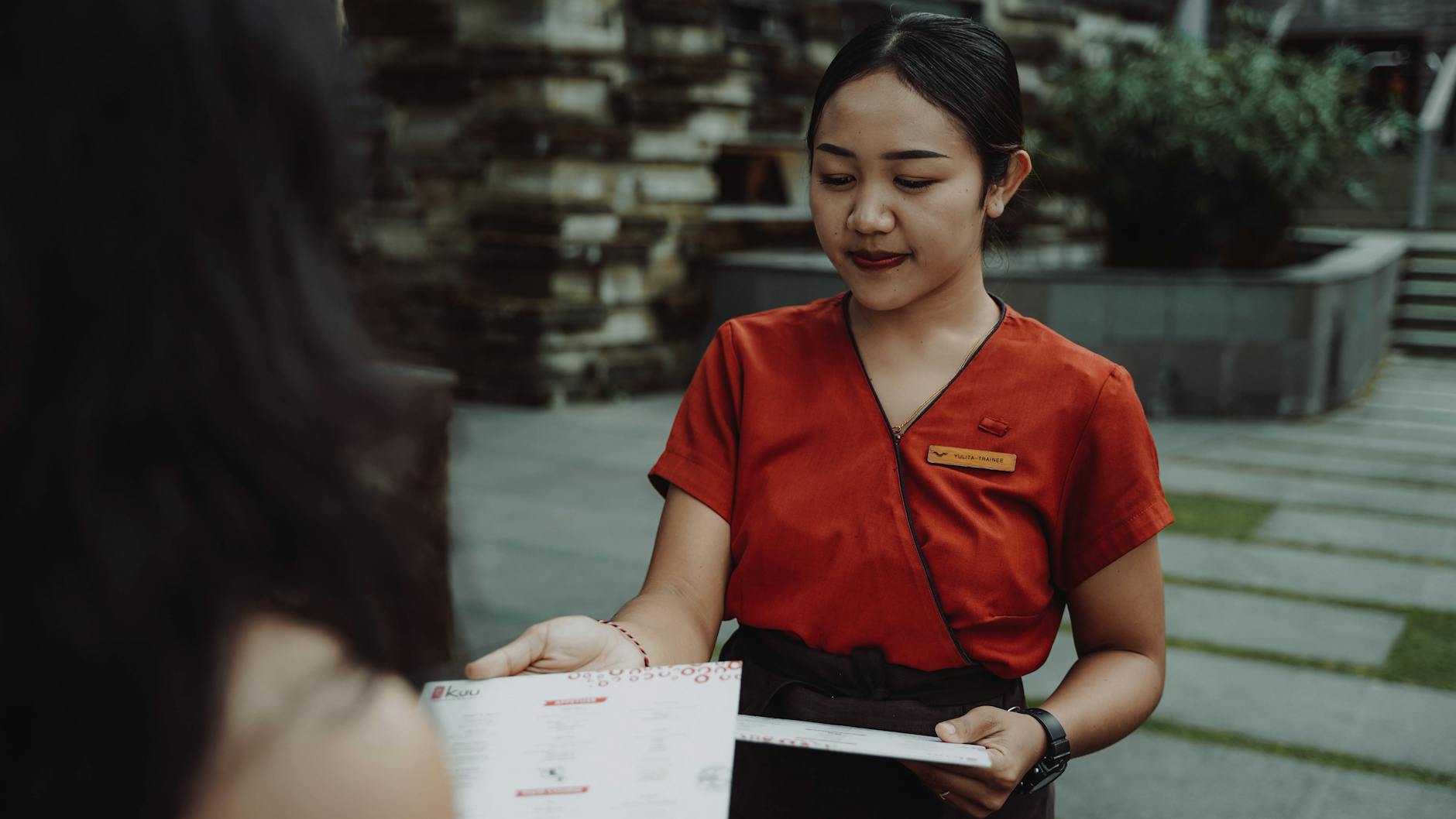 Restaurant Staff Discussing VIP Guests