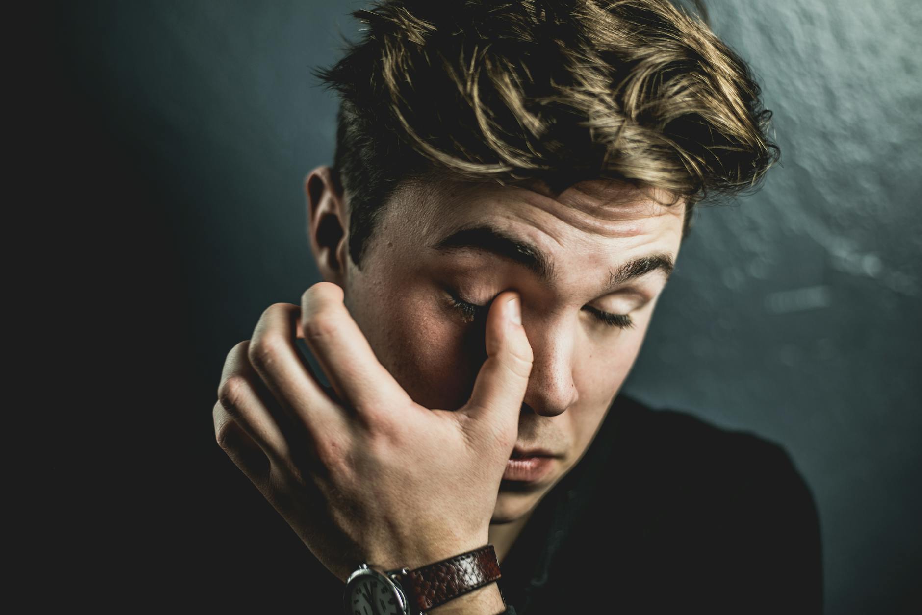 Person Rubbing Their Eye