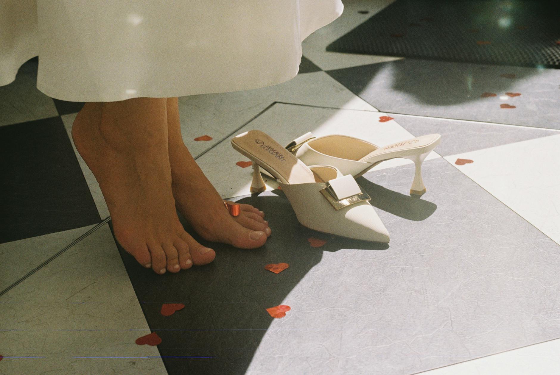 Person Stepping Onto Tile Floor