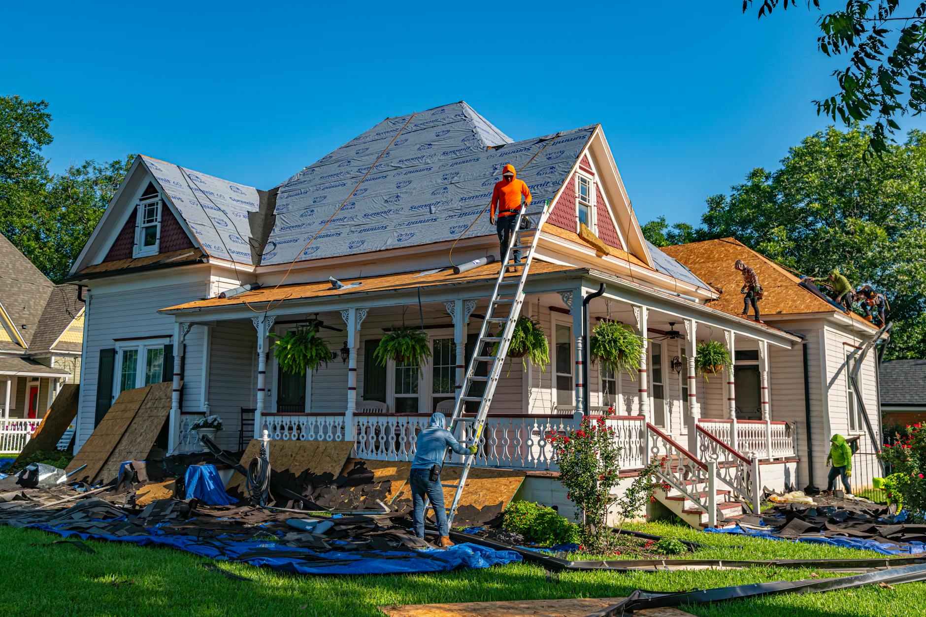 Worker Replacing Siding