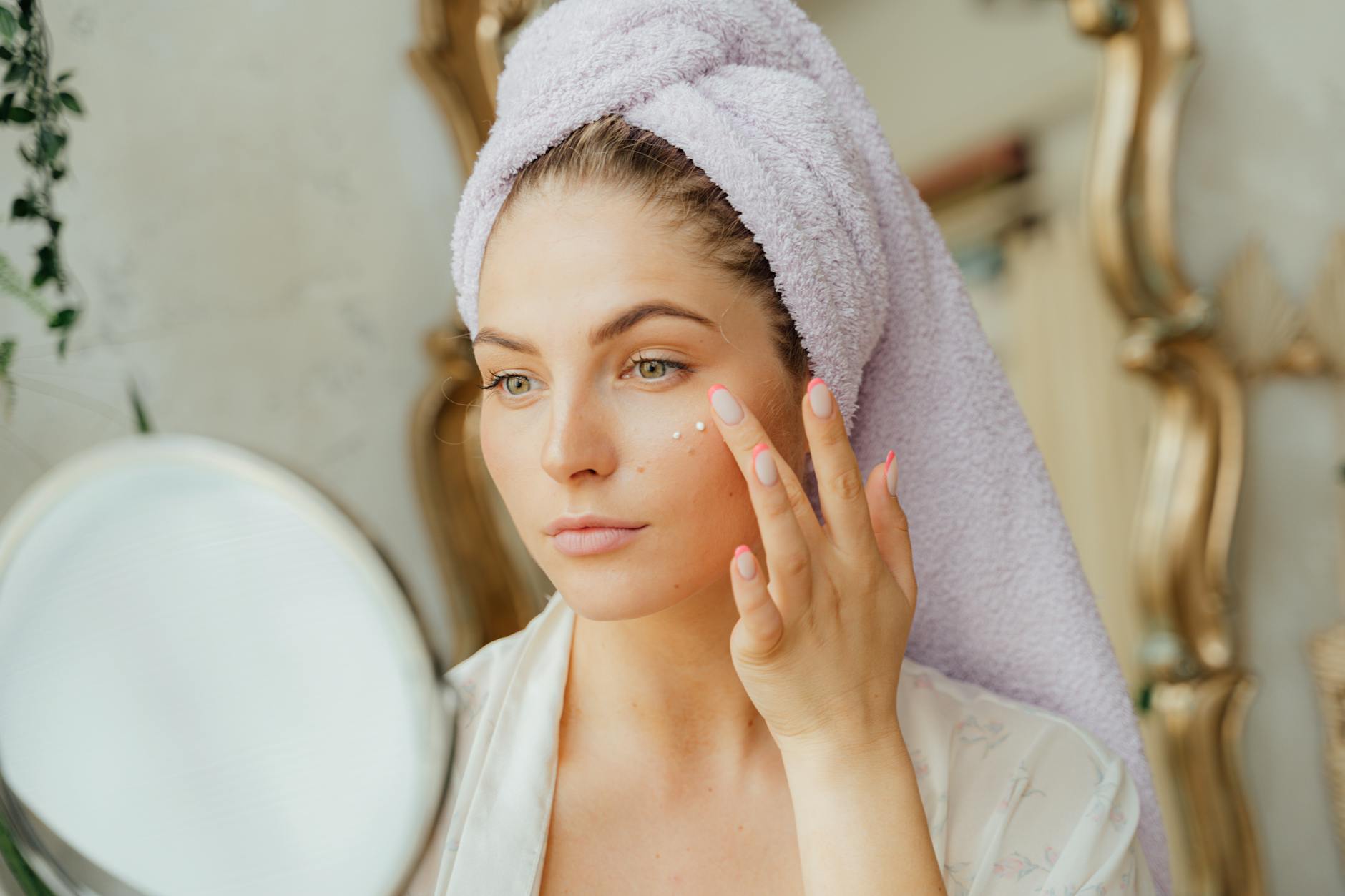 Woman Applying Moisturizer